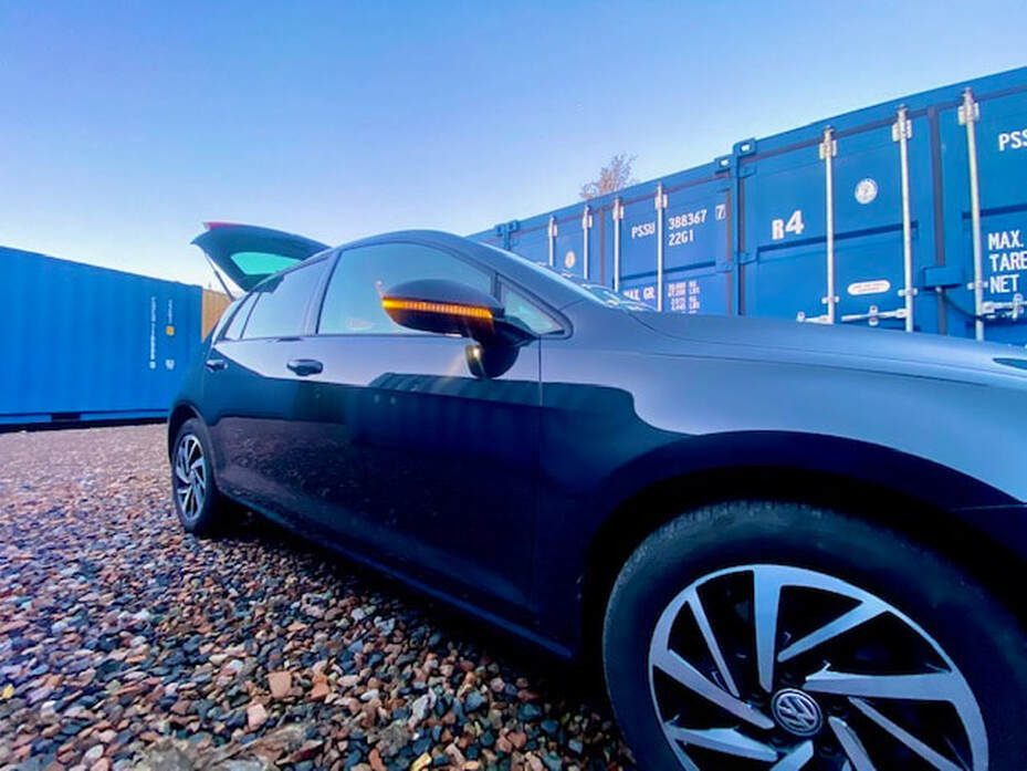car unloading items on a storage depot