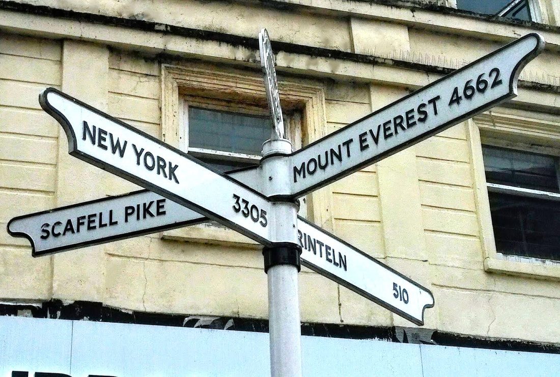 a signpost in cumbria leading to carlisle