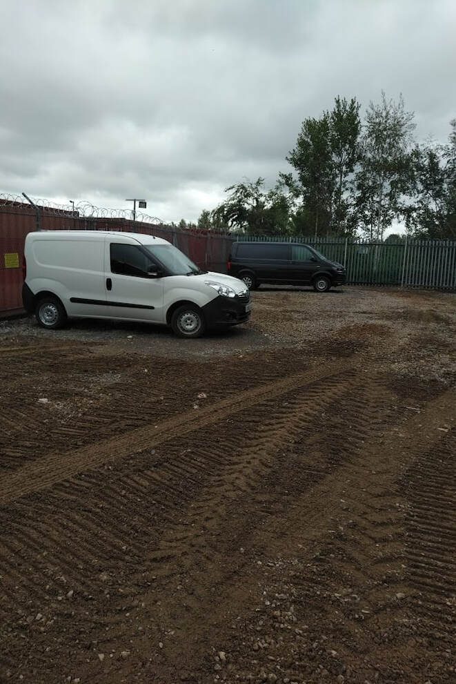 cars parked on an industrial depot