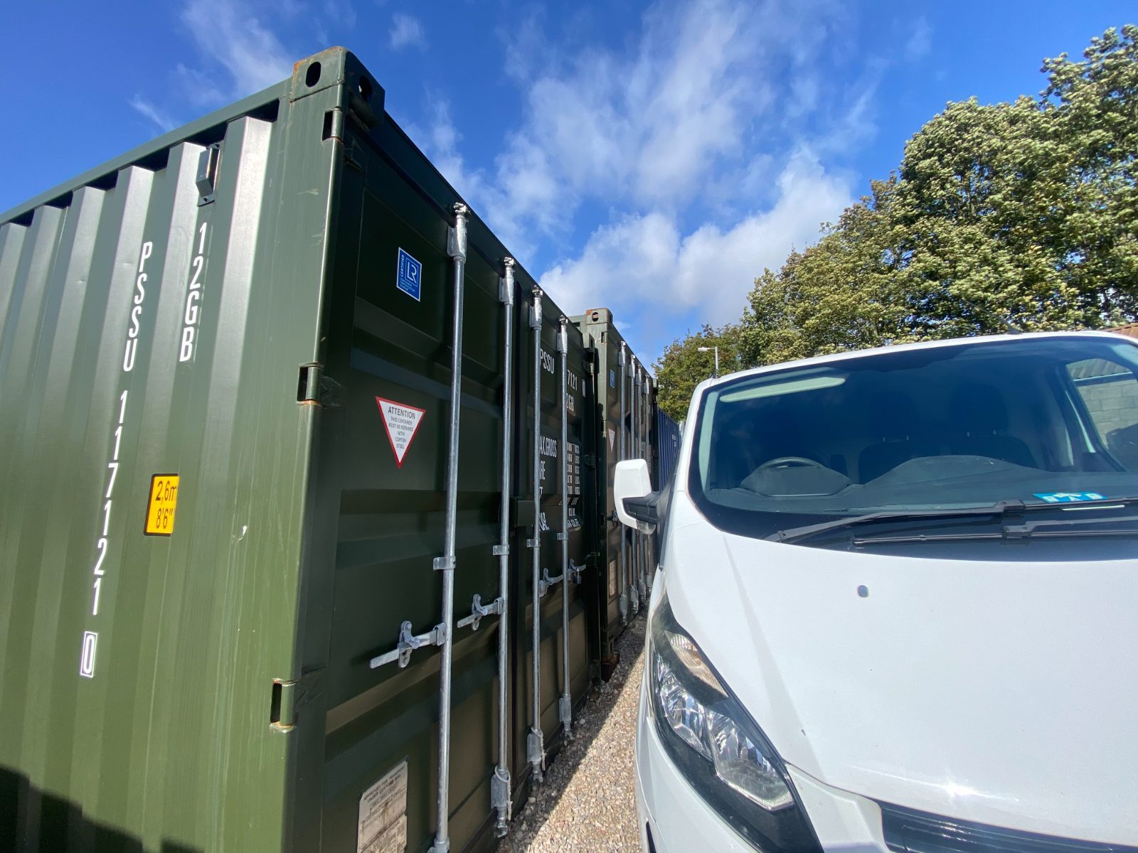 van parked outside a commercial storage shipping container