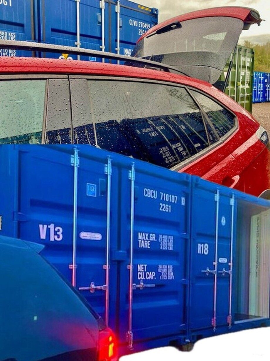 a red car beside a blue shipping container promoting ground floor units