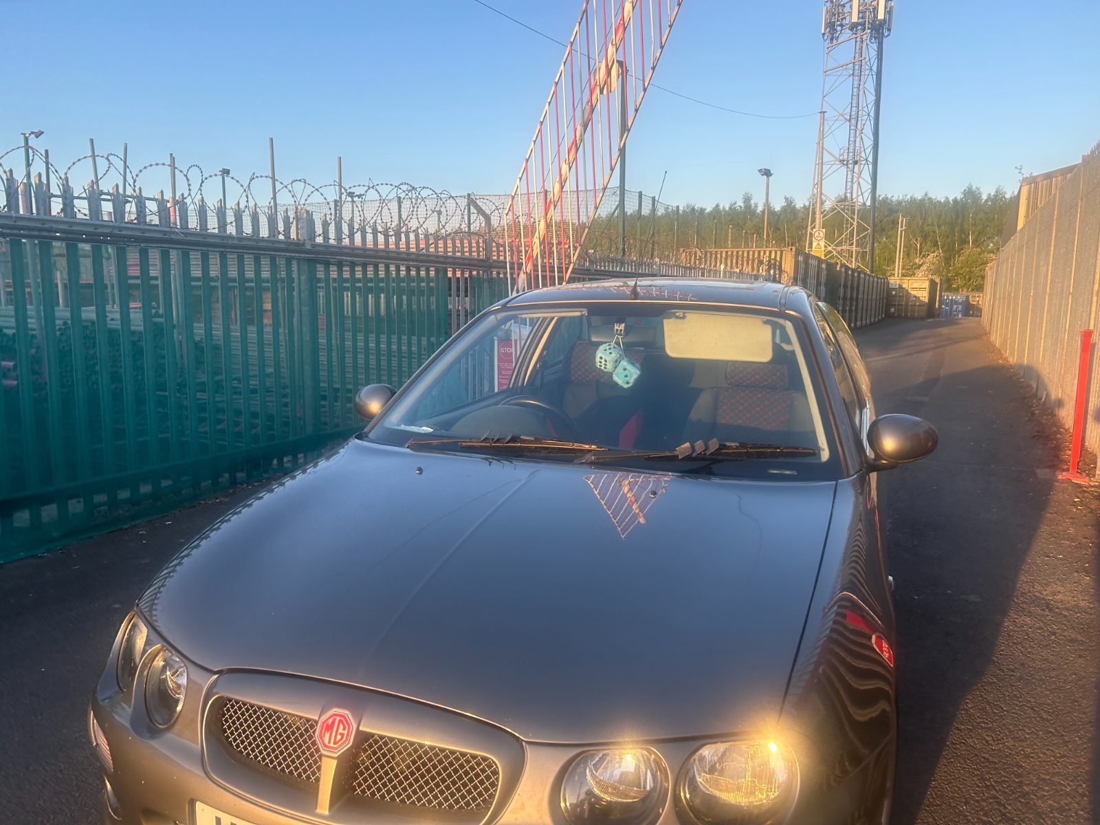 car waiting at the security barrier