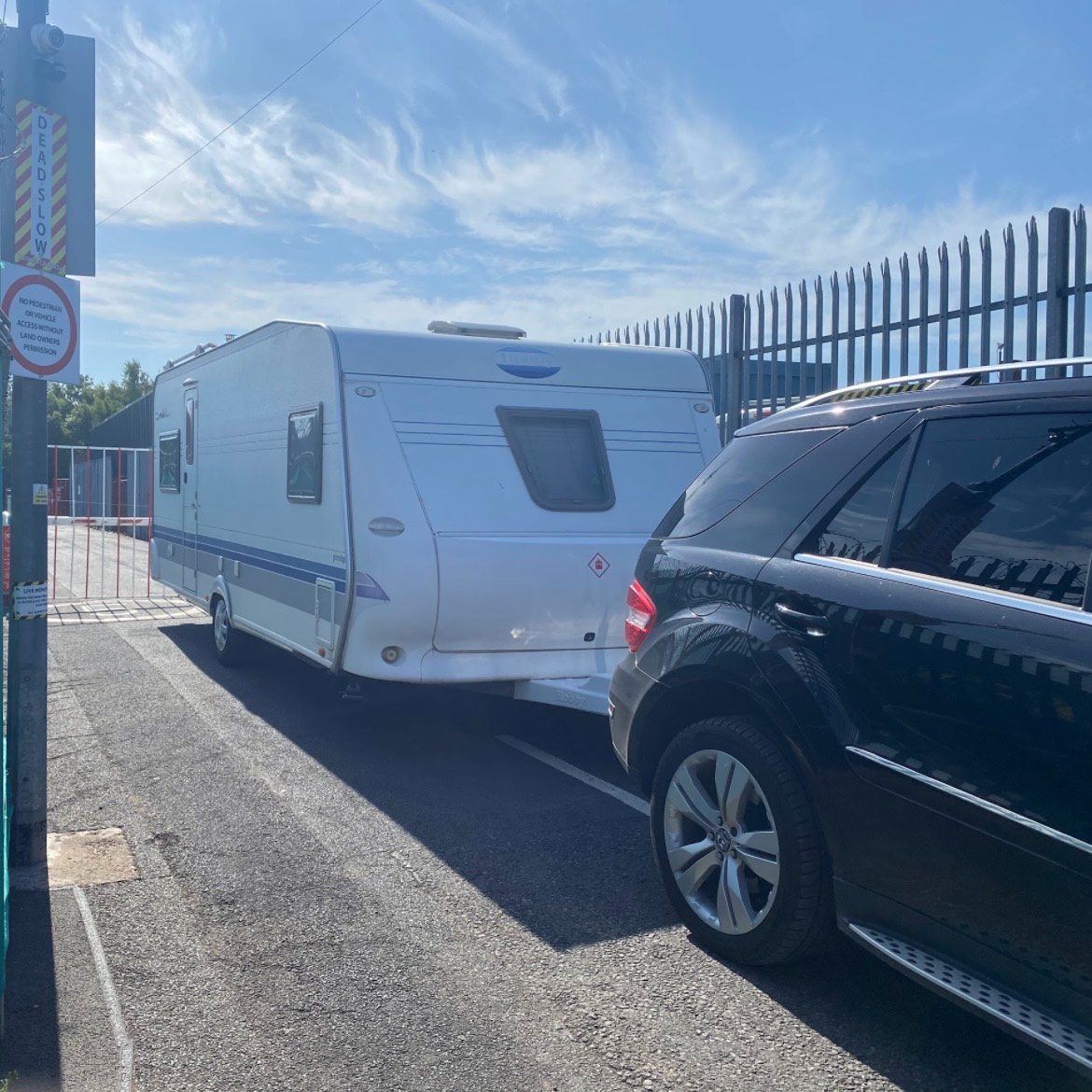 SUV towing a caravan off storage facility