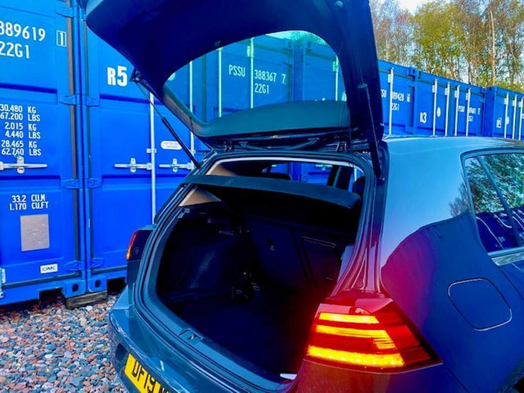 motor car unloading at a storage facility
