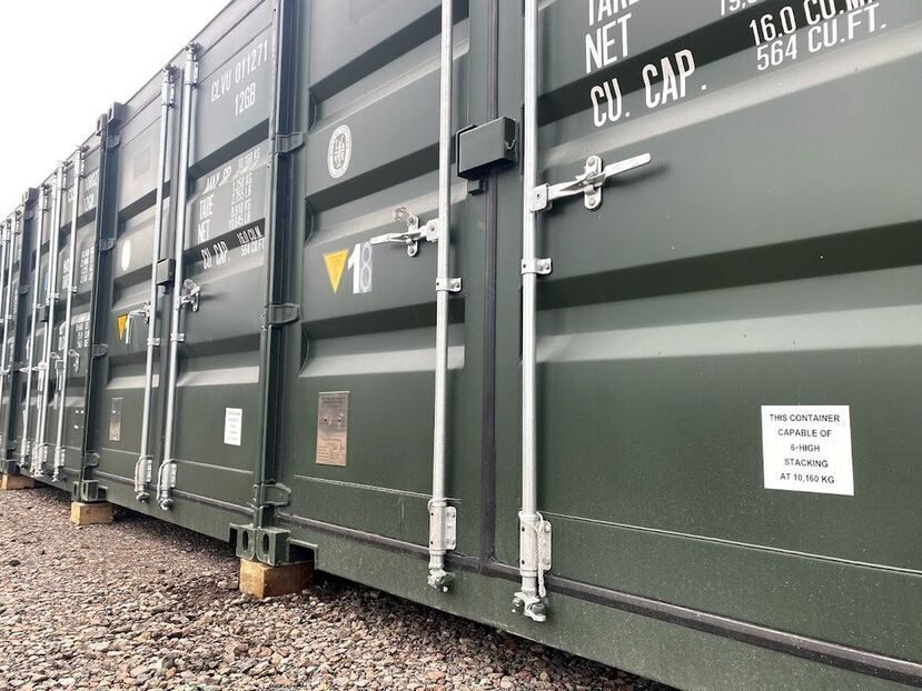 row of green storage shipping containers