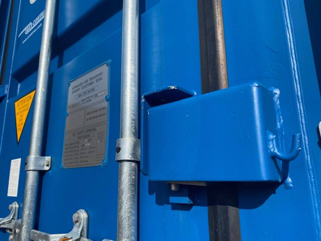 close up of a padlocked shipping container with lock box