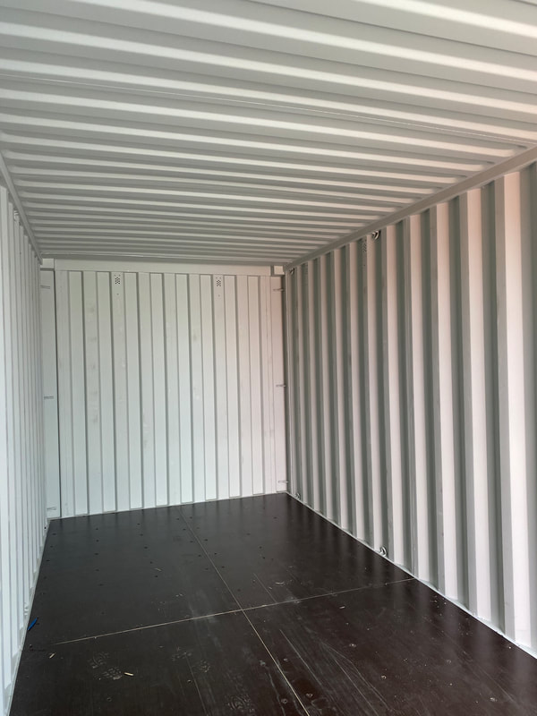 the inside of a large empty one trip shipping container
