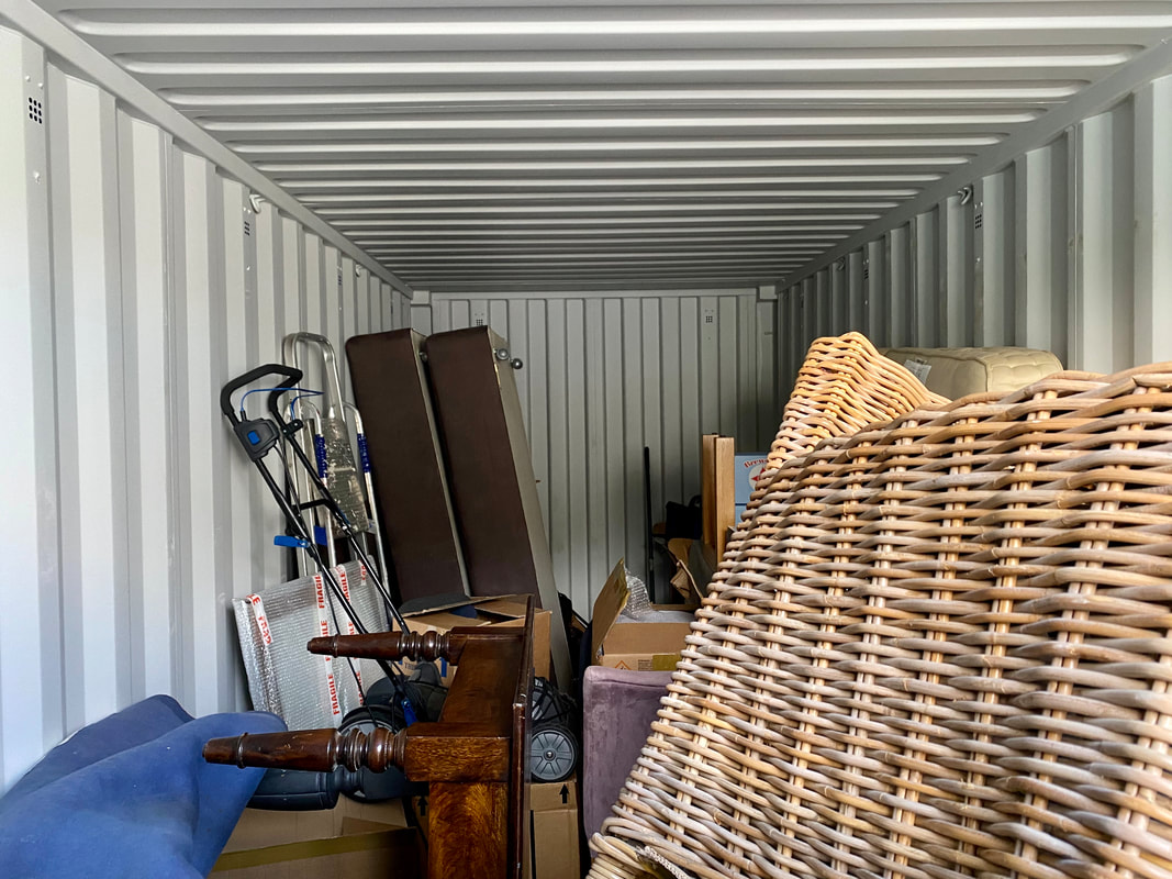 furniture stored within a storage container