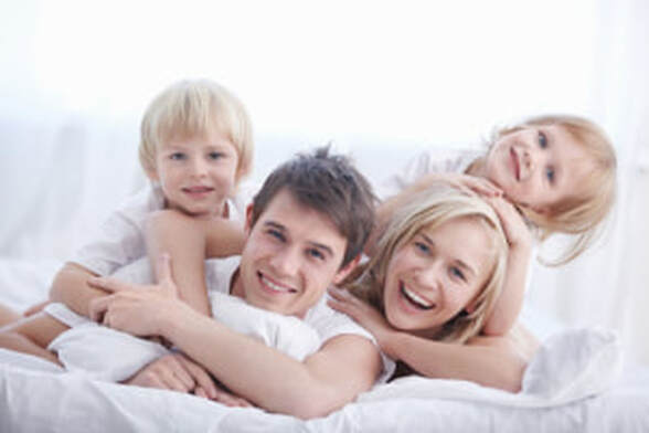 happy smiling family on a sofa