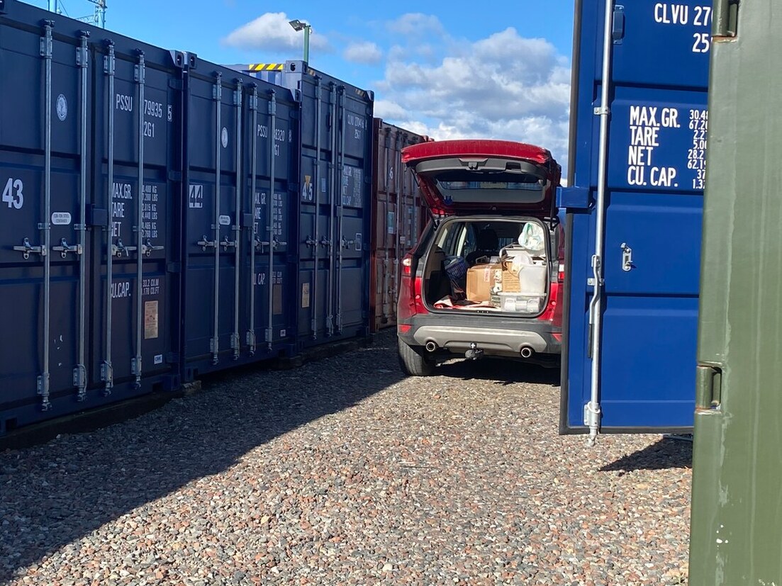 4x4 unloading boxes into a storage unit